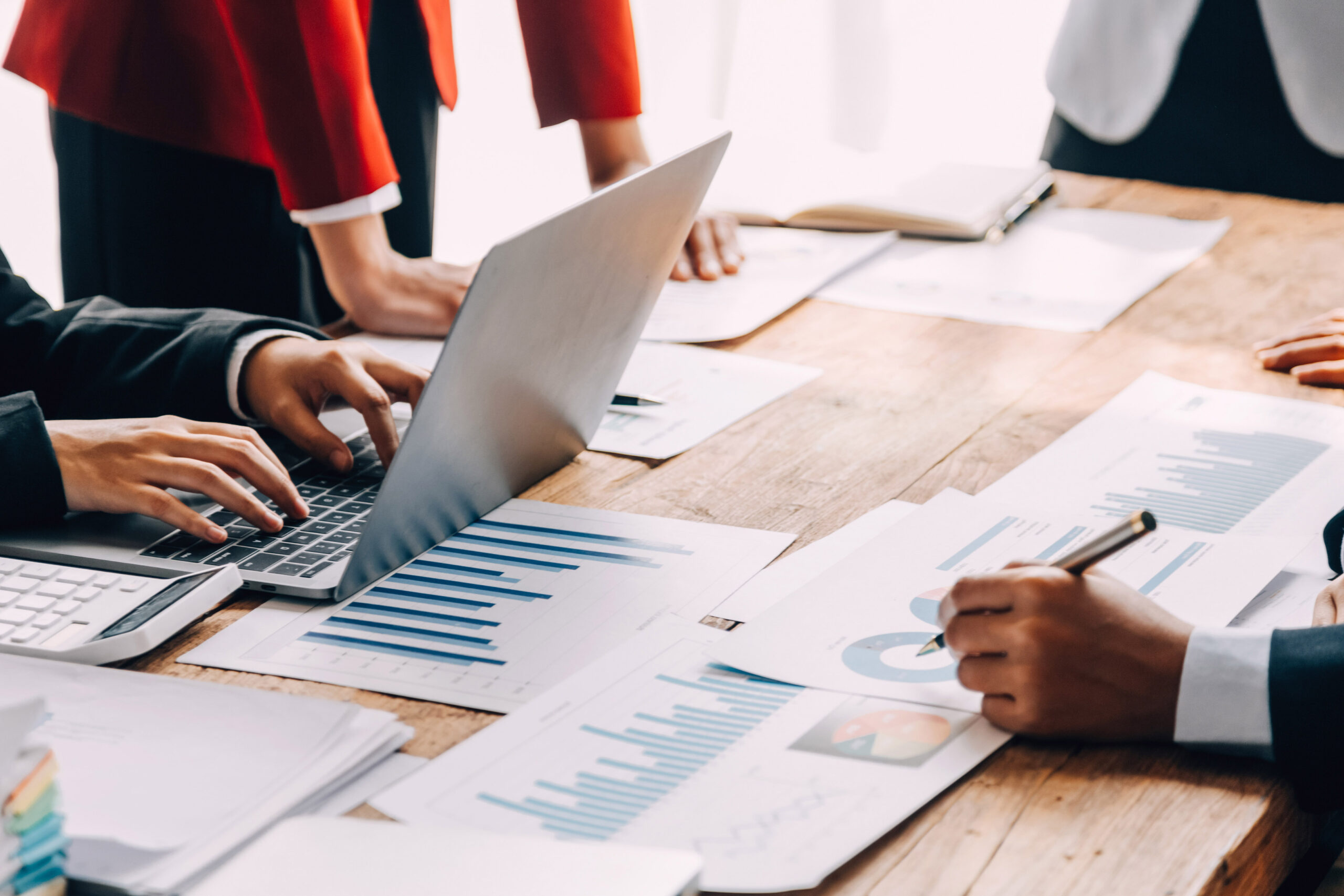 Financial analysts analyze business financial reports on a digit